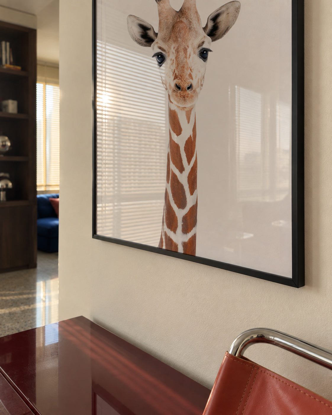 Baby Giraffe - Framed poster in an interior