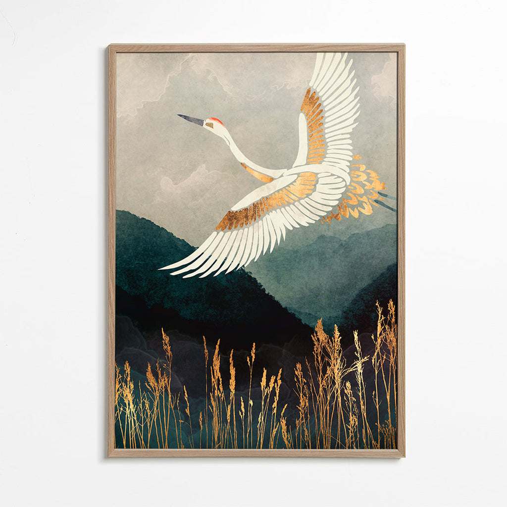 Gouden kraanvogel in vlucht