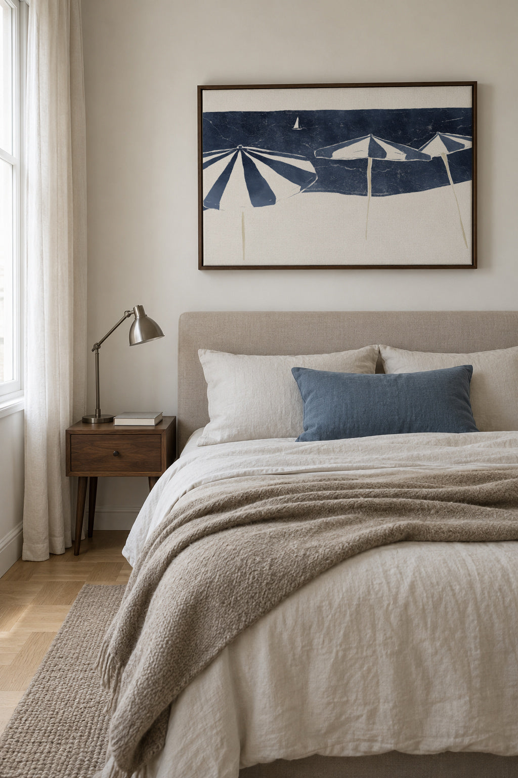 Blue Umbrellas and Sailboat - Framed canvas in an interior