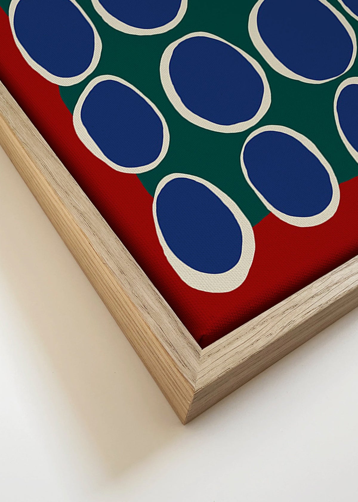 Geometrische print met blauwe ovalen en groen vlak – Canvas detail