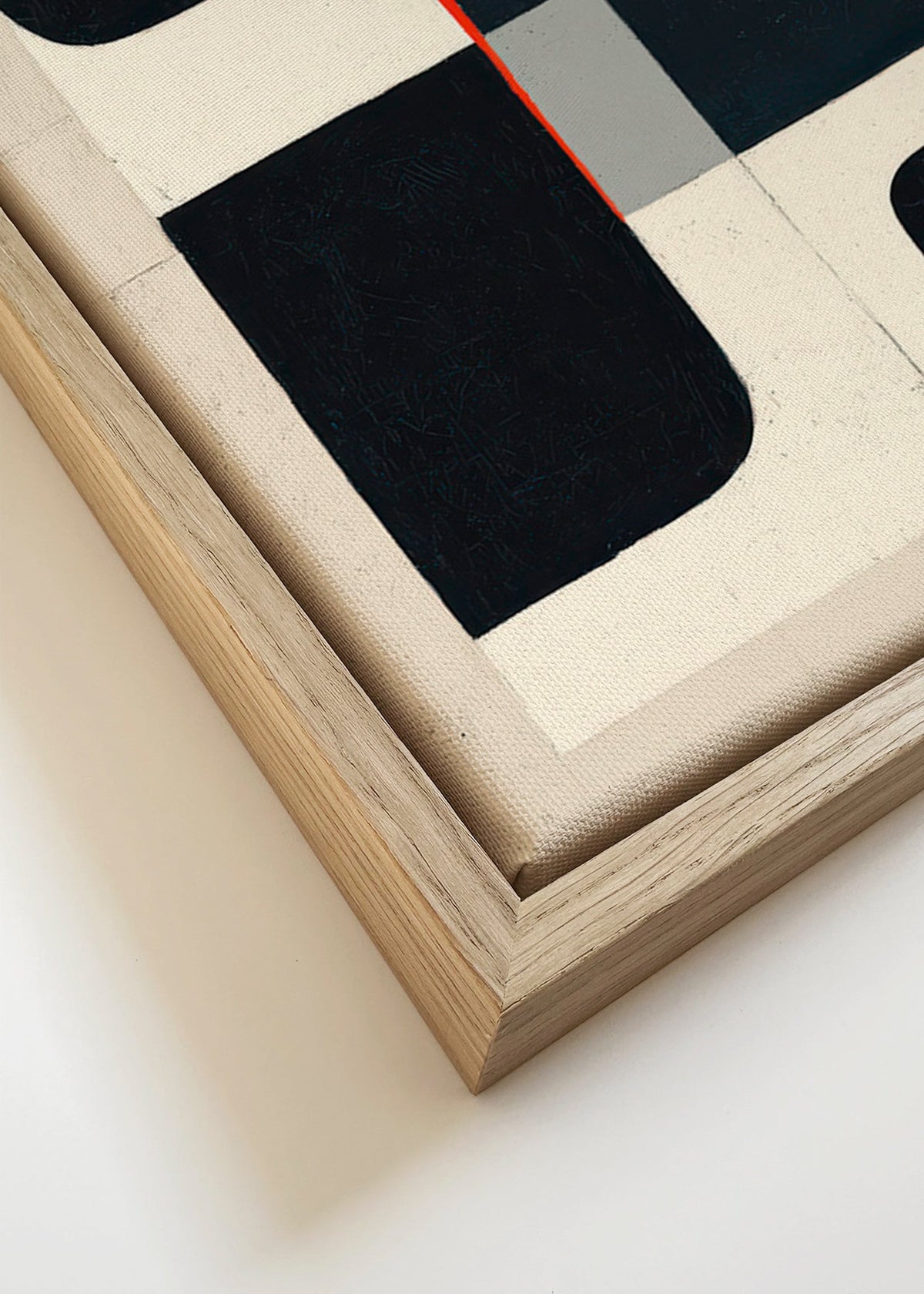 Geometrische poster met zwarte vlakken en rood accent – Canvas detail